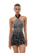 Vestido mini de tul negro con halter y adornos, de la marca Final Sale, mostrado en la imagen.
