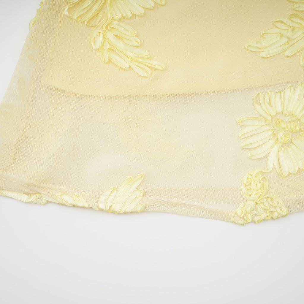 Vestido largo de corsé maxi Théoline amarillo con bordado floral y detalles de aplicación, estilo elegante y femenino.