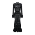 Vestido midi negro de manga larga con bordados y detalles de tachuelas de la marca Bridal, hecho a crochet.