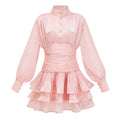 Vestido mini de encaje rosa con cuello alto y detalles de volantes, diseñado por Bridal, vista frontal sobre fondo neutro.