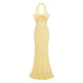 Vestido largo maxi de novia Antonia amarillo con lazo halter y escote alto, diseñado por Bridal.