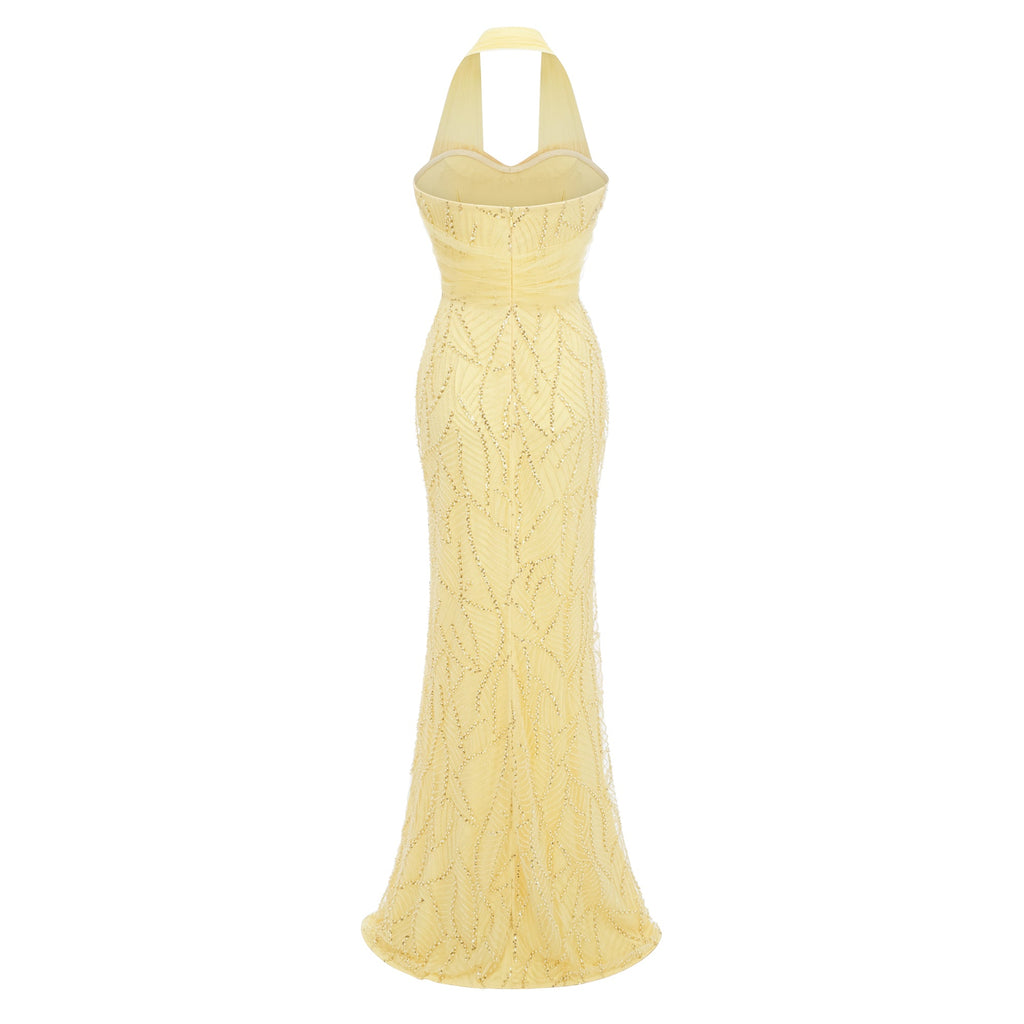 Vestido largo maxi amarillo con lazo halter y estilo bridal, mostrado en la imagen.