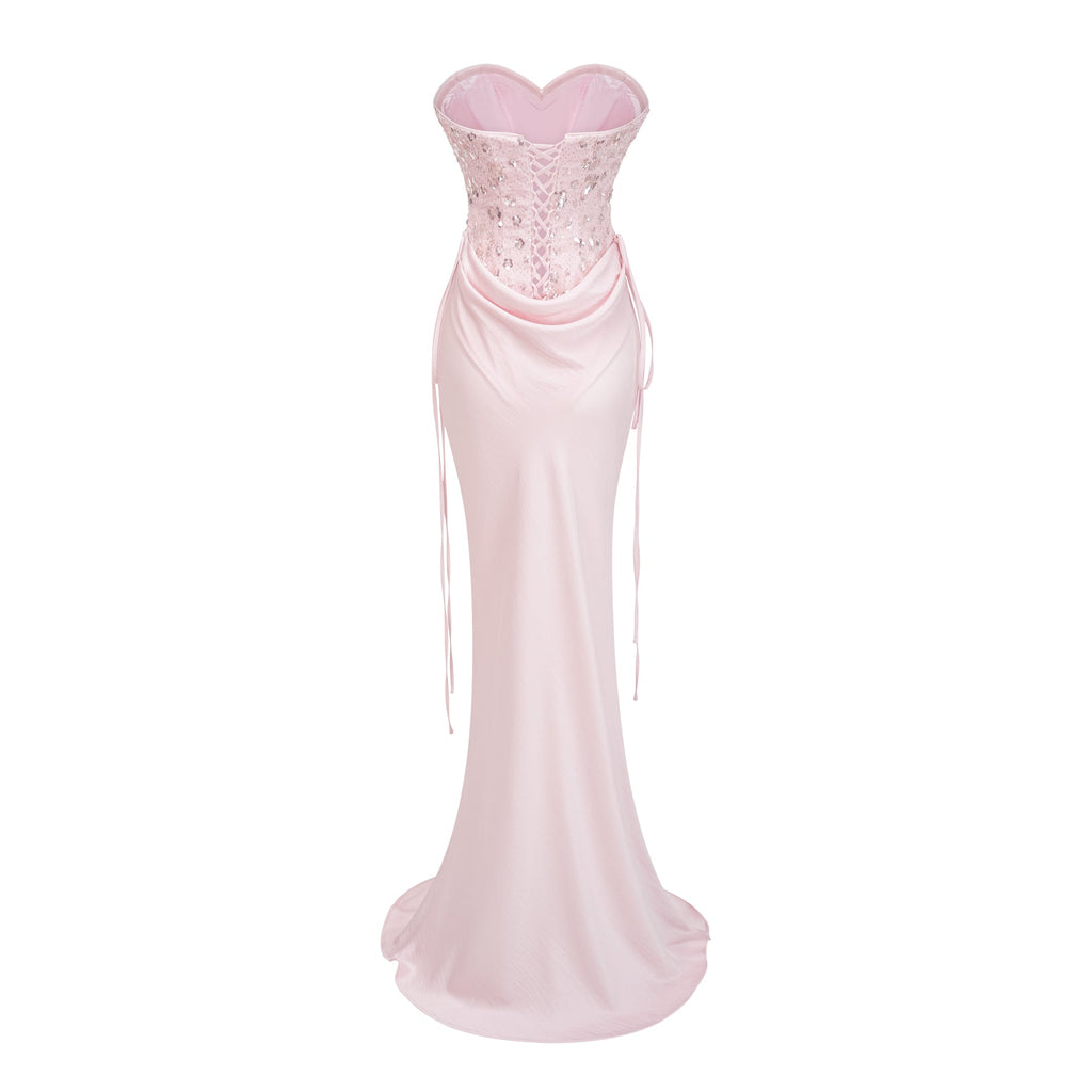 Conjunto de bodysuit corset rosa y falda de satén de Bridal, con detalles elegantes y ajustados en la parte superior y falda fluida.