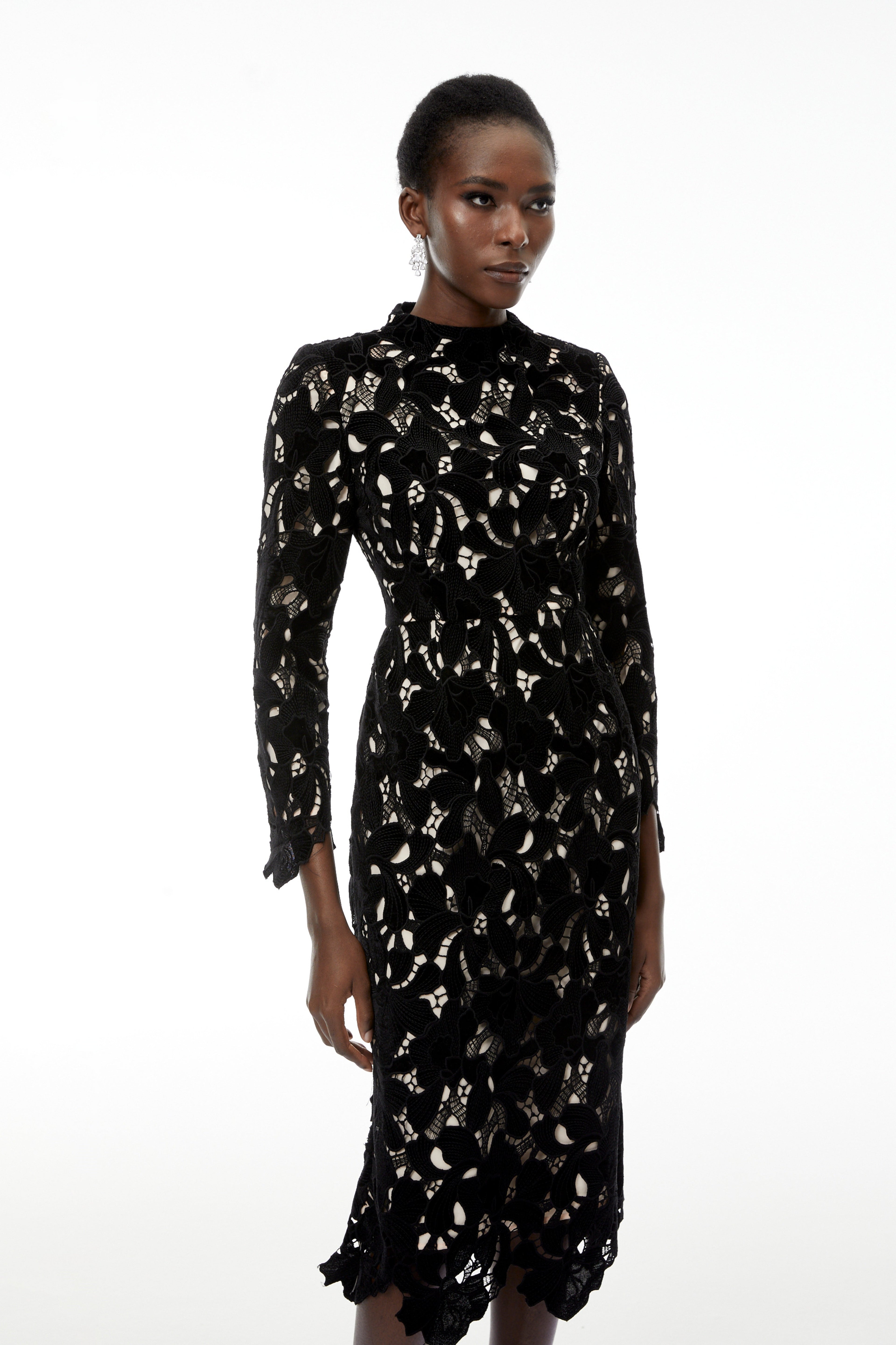 Vestido midi negro con bordado floral y recortes en encaje, estilo elegante de MRMelbourne, en la imagen.