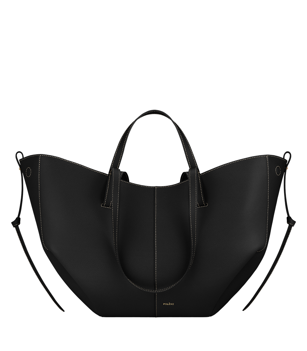 Bolso de mano Polène Cyme en piel negra con costuras contrastadas y acabado granuloso, vista frontal.
