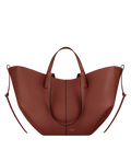 Bolso de mano Polène Cyme en arcilla roja con textura granulada, vista frontal del diseño elegante y moderno.